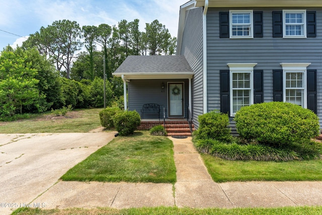 429 Tanbridge Rd, Wilmington, NC 28405 - view of front of house with covered porch and a front lawn