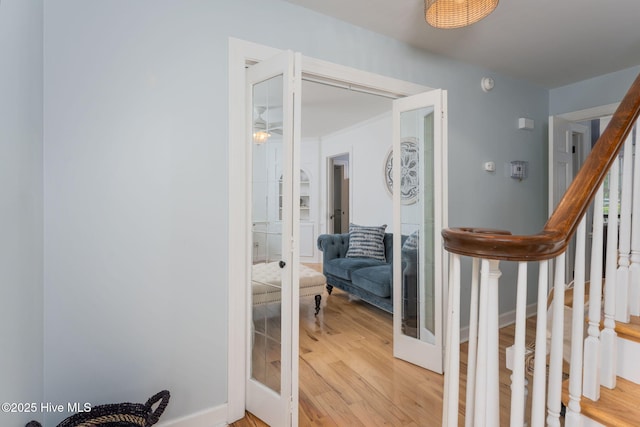 429 Tanbridge Rd, Wilmington, NC 28405 - hallway with french doors, stairs, and light wood-style floors