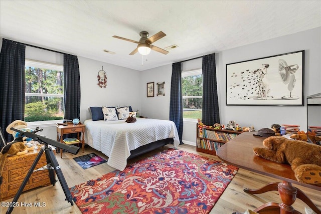 bedroom with light wood finished floors and ceiling fan
