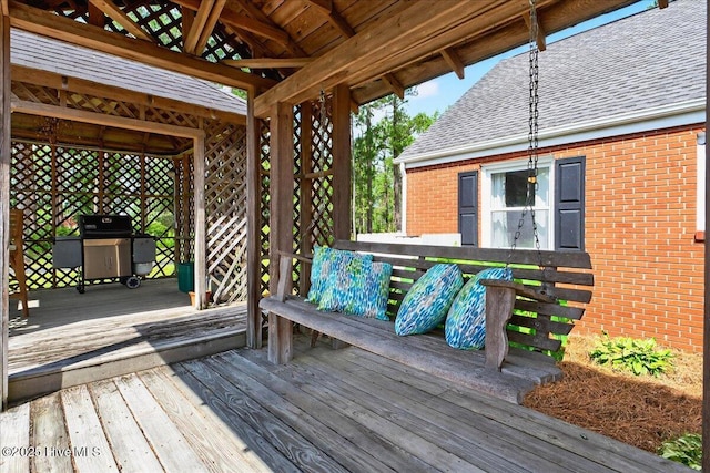 deck featuring a grill