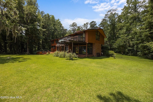 1402 Green Springs Rd, New Bern, NC 28560 - view of green lawn with a deck and a forest view