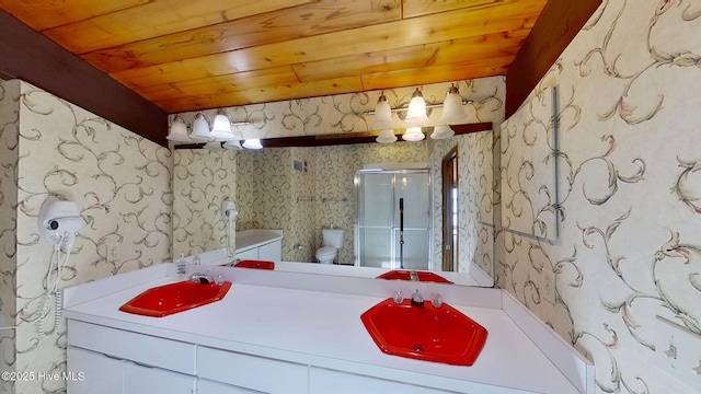 1402 Green Springs Rd, New Bern, NC 28560 - full bathroom with wallpapered walls, double vanity, a shower stall, and wooden ceiling