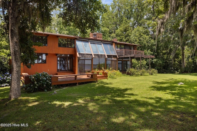 1402 Green Springs Rd, New Bern, NC 28560 - back of property with an exterior structure, a chimney, a lawn, an outdoor structure, and a deck