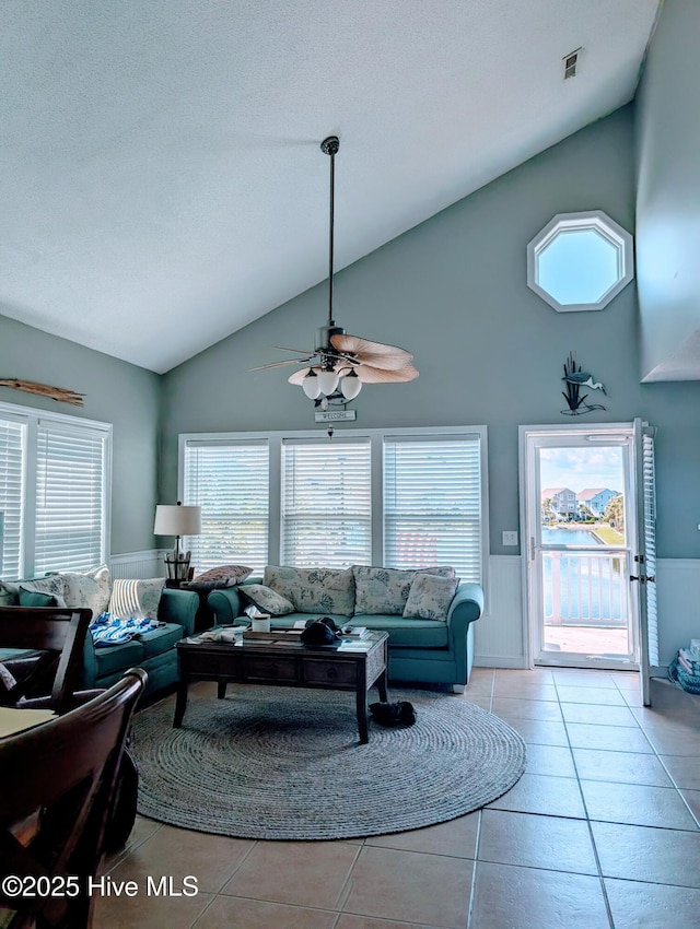 7 Oleander Ln, Ocean Isle Beach, NC 28469 - tiled living area featuring high vaulted ceiling, plenty of natural light, and ceiling fan