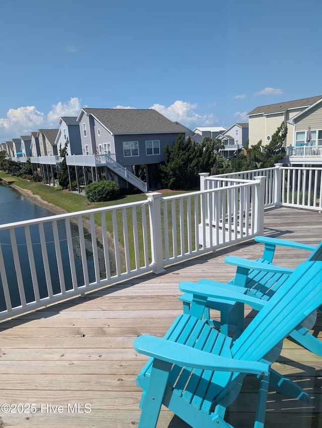 7 Oleander Ln, Ocean Isle Beach, NC 28469 - wooden terrace with a residential view and a water view