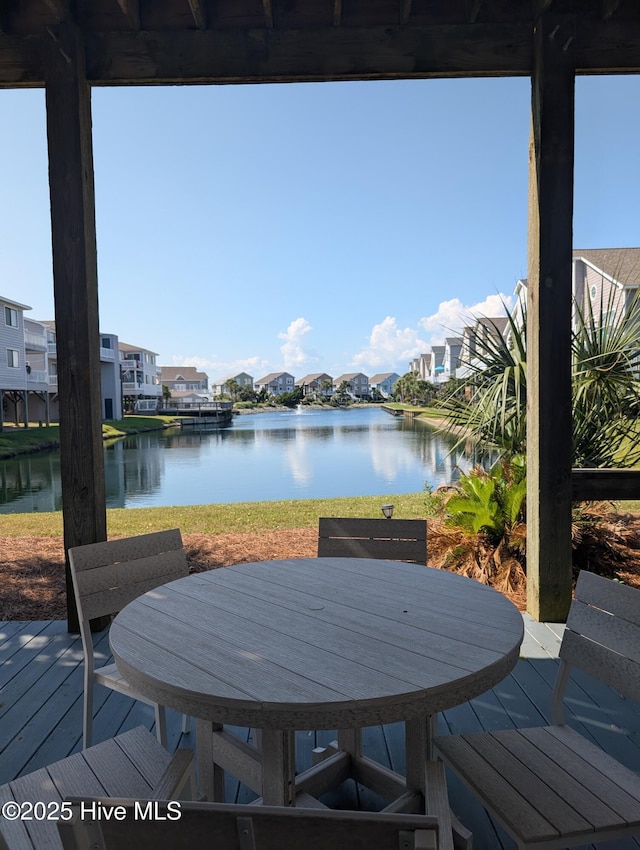 7 Oleander Ln, Ocean Isle Beach, NC 28469 - wooden terrace featuring a residential view and a water view
