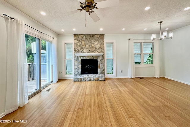 122 Ethel Dr, Emerald Isle, NC 28594 - unfurnished living room with wood finished floors, recessed lighting, a textured ceiling, ceiling fan, and a chandelier
