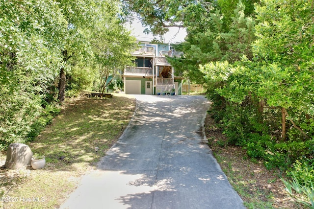 122 Ethel Dr, Emerald Isle, NC 28594 - view of front of property featuring concrete driveway, an attached garage, and a balcony