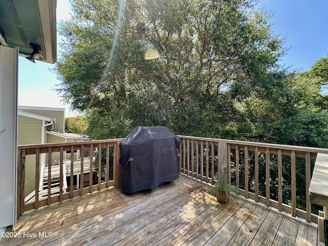 122 Ethel Dr, Emerald Isle, NC 28594 - wooden terrace with a grill