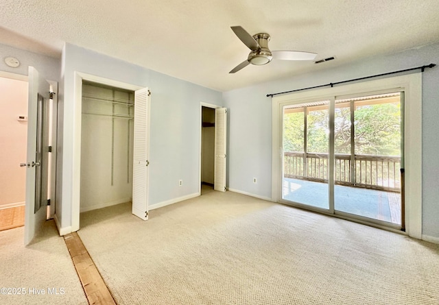 122 Ethel Dr, Emerald Isle, NC 28594 - unfurnished bedroom with access to outside, light colored carpet, a closet, a textured ceiling, and a ceiling fan