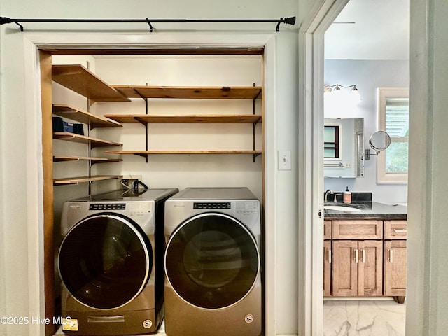 122 Ethel Dr, Emerald Isle, NC 28594 - laundry area with light marble finish flooring and separate washer and dryer