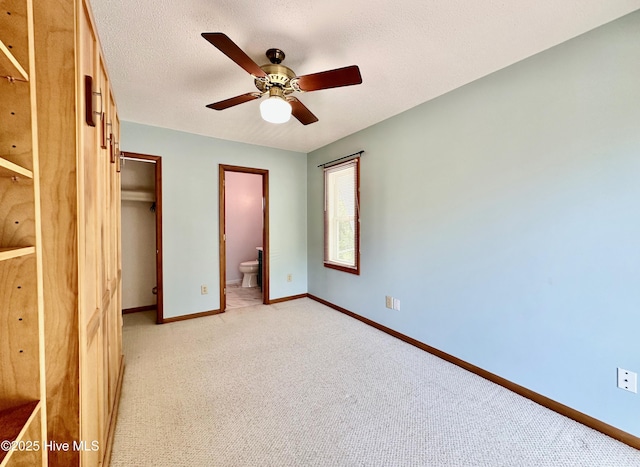 122 Ethel Dr, Emerald Isle, NC 28594 - unfurnished bedroom featuring light carpet, a closet, ensuite bath, and a ceiling fan