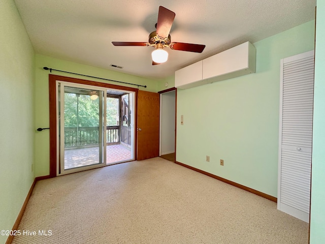 122 Ethel Dr, Emerald Isle, NC 28594 - unfurnished bedroom featuring access to exterior, light colored carpet, and a ceiling fan