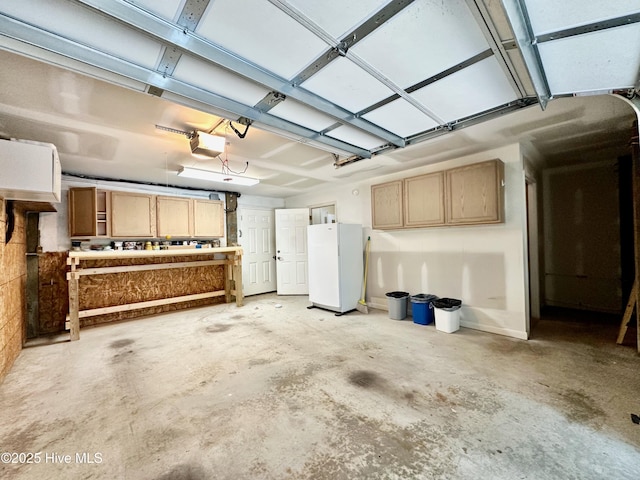 122 Ethel Dr, Emerald Isle, NC 28594 - garage with freestanding refrigerator and a garage door opener