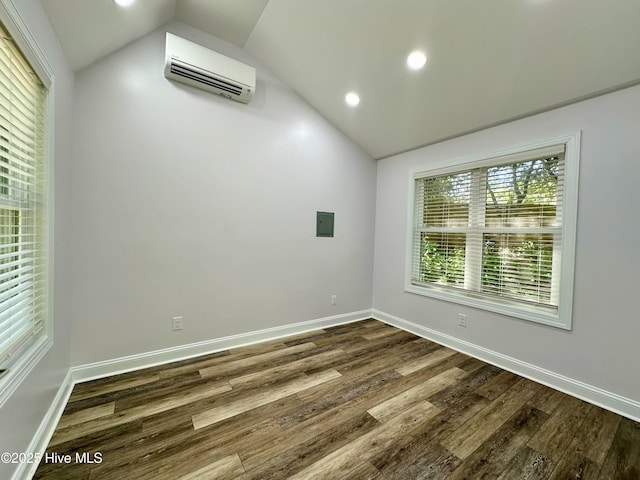 122 Ethel Dr, Emerald Isle, NC 28594 - unfurnished room featuring a wall mounted air conditioner, vaulted ceiling, dark wood finished floors, recessed lighting, and electric panel