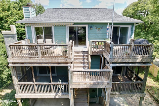 122 Ethel Dr, Emerald Isle, NC 28594 - rear view of property with roof with shingles, a deck, a chimney, and a sunroom