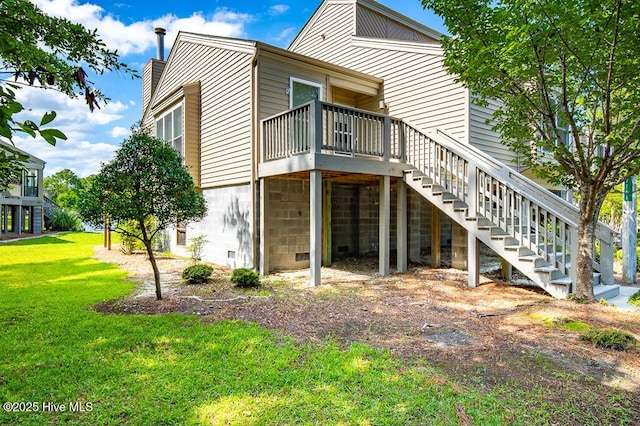7161 Windward Dr, New Bern, NC 28560 - rear view of house with stairway, a lawn, a wooden deck, and a chimney