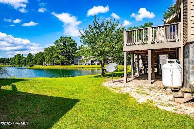 7161 Windward Dr, New Bern, NC 28560 - view of green lawn featuring a deck with water view and stairway