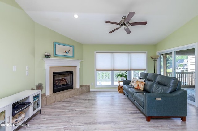 7161 Windward Dr, New Bern, NC 28560 - living area with vaulted ceiling, wood finished floors, a ceiling fan, a fireplace, and recessed lighting
