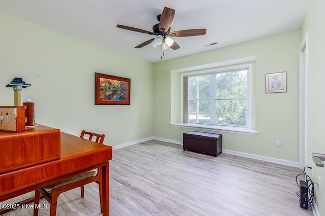 7161 Windward Dr, New Bern, NC 28560 - home office featuring light wood-style floors and a ceiling fan
