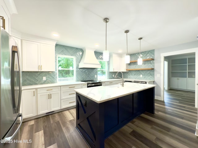 9891 Red Fox, Winnabow, NC 28479 - kitchen with freestanding refrigerator, premium range hood, backsplash, electric range, and white cabinetry