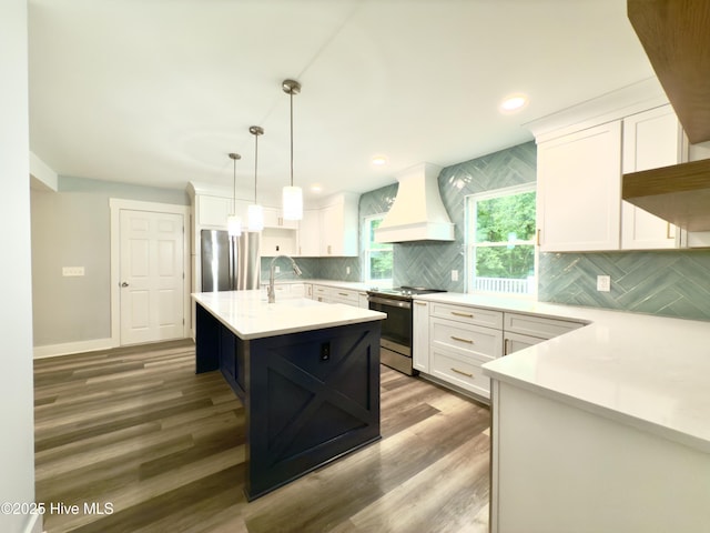 9891 Red Fox, Winnabow, NC 28479 - kitchen featuring stainless steel appliances, custom exhaust hood, light countertops, white cabinetry, and recessed lighting