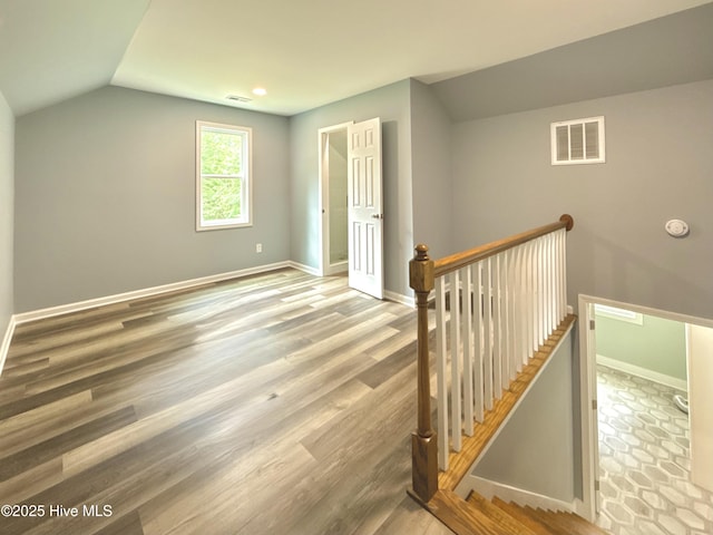 9891 Red Fox, Winnabow, NC 28479 - additional living space with lofted ceiling, wood finished floors, and recessed lighting