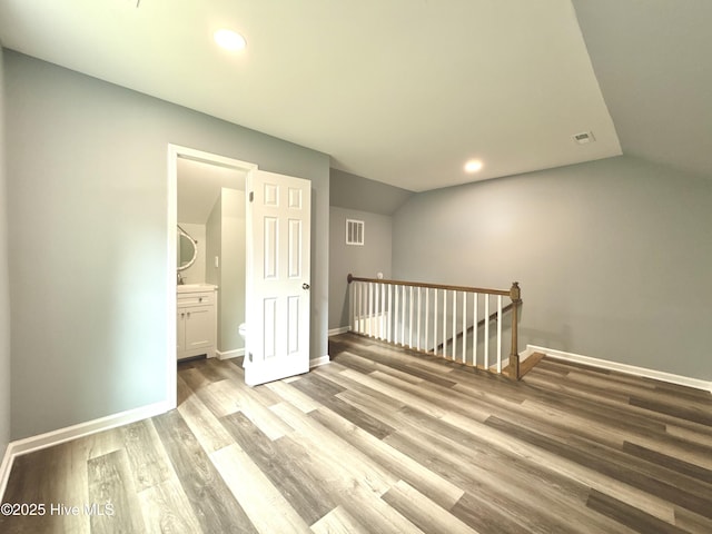 9891 Red Fox, Winnabow, NC 28479 - unfurnished room featuring light wood-style floors, vaulted ceiling, and recessed lighting