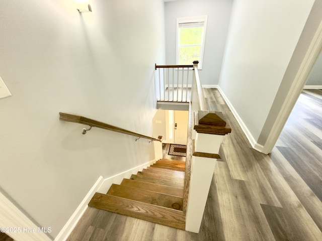 9891 Red Fox, Winnabow, NC 28479 - staircase featuring wood finished floors and baseboards