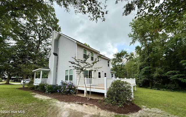 9891 Red Fox, Winnabow, NC 28479 - view of home's exterior with a lawn and a deck