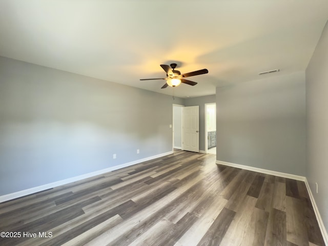 9891 Red Fox, Winnabow, NC 28479 - empty room featuring a ceiling fan and dark wood-style floors