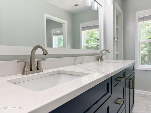 9891 Red Fox, Winnabow, NC 28479 - full bathroom with double vanity and marble look tiles