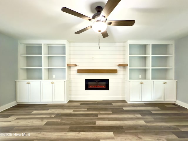 9891 Red Fox, Winnabow, NC 28479 - unfurnished living room with a ceiling fan, dark wood finished floors, and a fireplace