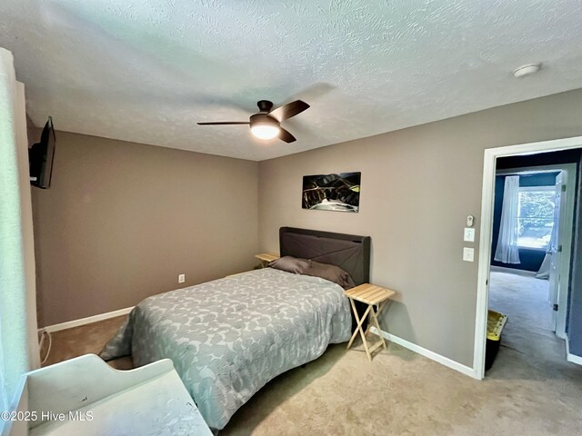 735 N Bennett St Unit A, Southern Pines, NC 28387 - bedroom with carpet floors, a textured ceiling, and ceiling fan