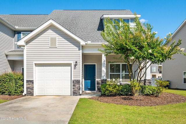 1620 Bratton Ct, Wilmington, NC 28405 - view of front facade featuring roof with shingles, stone siding, a porch, a garage, and driveway