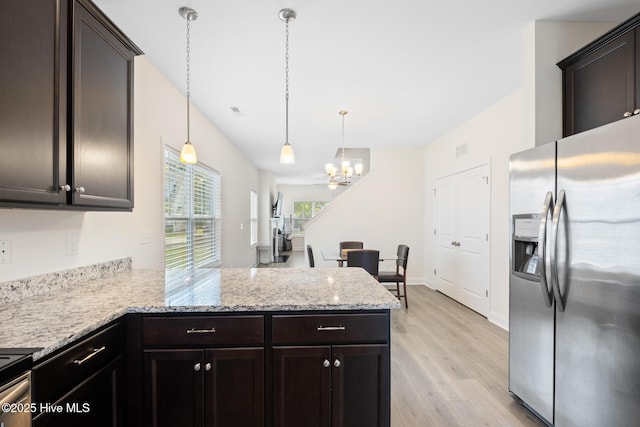 1620 Bratton Ct, Wilmington, NC 28405 - kitchen with stainless steel refrigerator with ice dispenser, a chandelier, a peninsula, light wood-style floors, and dark brown cabinets