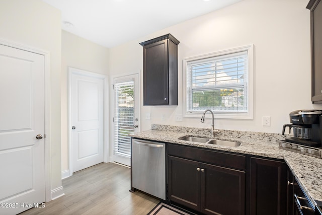 1620 Bratton Ct, Wilmington, NC 28405 - kitchen featuring stainless steel dishwasher, light wood-style flooring, and light stone countertops