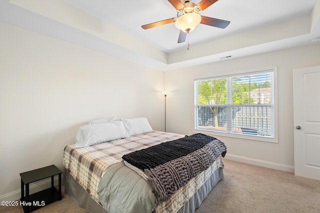 1620 Bratton Ct, Wilmington, NC 28405 - bedroom with light colored carpet, ceiling fan, and a tray ceiling