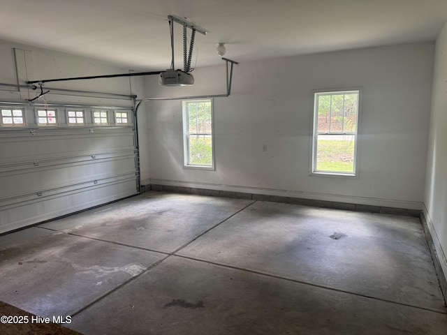 600 Burning Tree Rd, Pinehurst, NC 28374 - garage with a garage door opener and baseboards