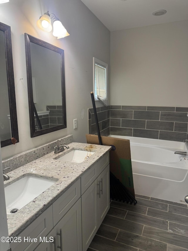 600 Burning Tree Rd, Pinehurst, NC 28374 - full bath featuring a bath, double vanity, and wood tiled floors