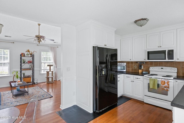 2827 Sapling Cir, Wilmington, NC 28411 - kitchen with black fridge with ice dispenser, electric range, dark countertops, dark wood finished floors, and tasteful backsplash