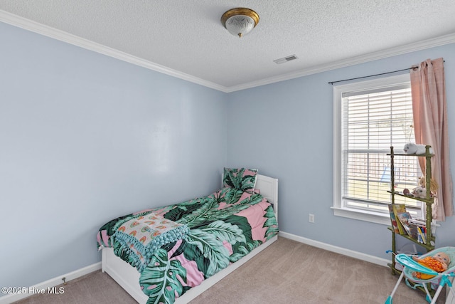 2827 Sapling Cir, Wilmington, NC 28411 - carpeted bedroom with multiple windows, ornamental molding, and a textured ceiling