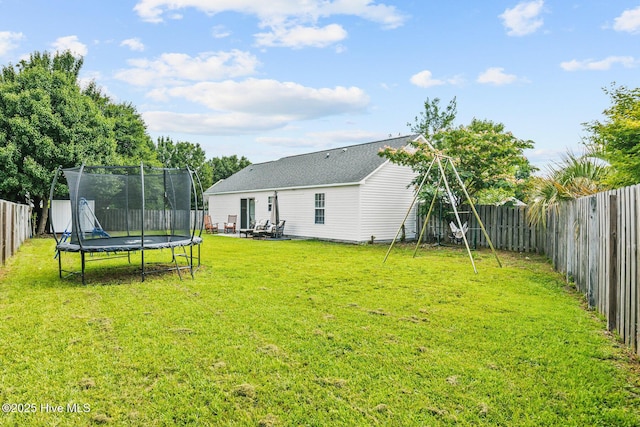 2827 Sapling Cir, Wilmington, NC 28411 - fenced backyard featuring a trampoline