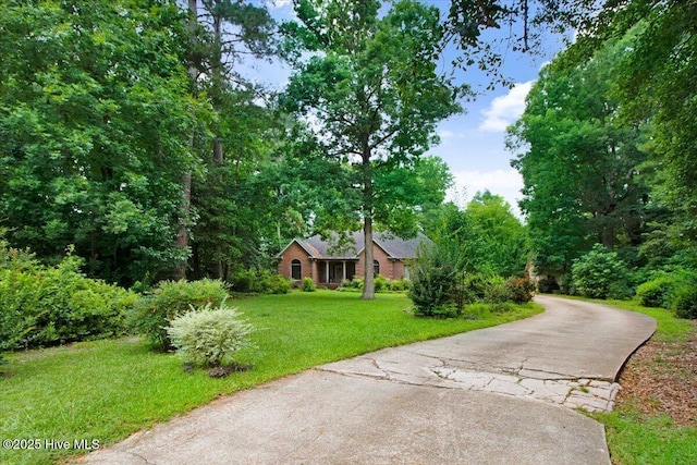 104 Tall Pines Pl, Goldsboro, NC 27534 - view of front of home with a front yard and asphalt driveway