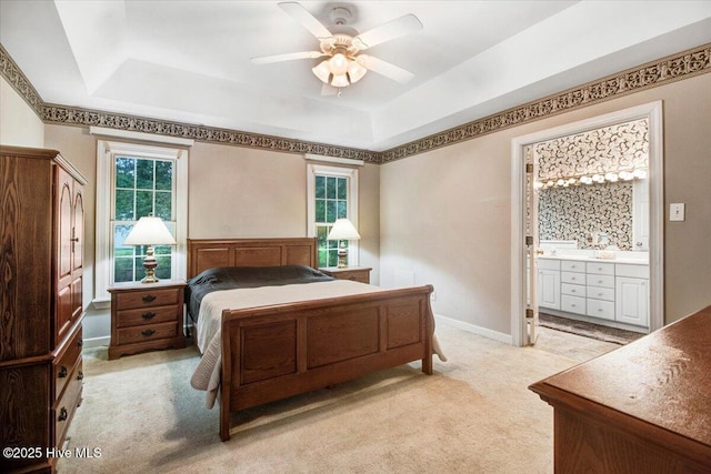 104 Tall Pines Pl, Goldsboro, NC 27534 - bedroom with a raised ceiling, light colored carpet, ensuite bath, and ceiling fan