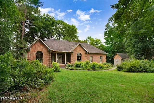 104 Tall Pines Pl, Goldsboro, NC 27534 - ranch-style house with brick siding, a front lawn, a porch, and roof with shingles