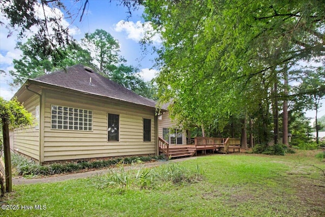 104 Tall Pines Pl, Goldsboro, NC 27534 - back of house with a wooden deck, a yard, and a shingled roof