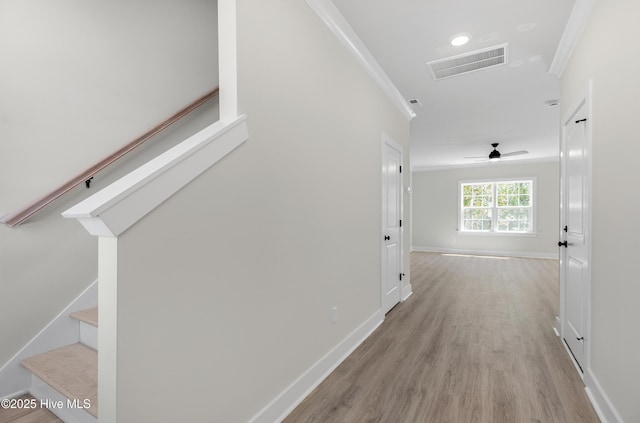 208 Triton Ln, Surf City, NC 28445 - hall featuring ornamental molding, stairs, and light wood-type flooring