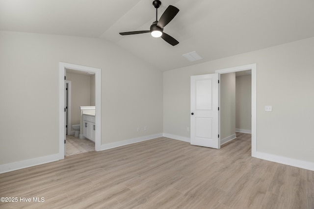 208 Triton Ln, Surf City, NC 28445 - unfurnished bedroom with vaulted ceiling, light wood-type flooring, ensuite bathroom, and ceiling fan