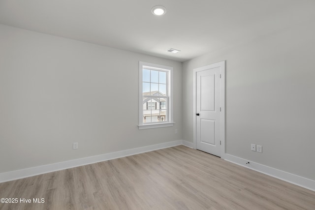 208 Triton Ln, Surf City, NC 28445 - empty room with light wood-style floors and recessed lighting